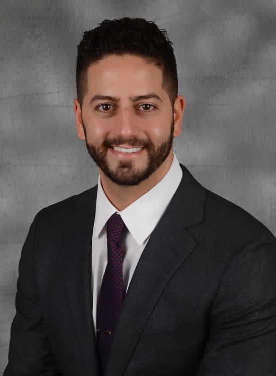 Brandon Dentist, Dr. Fadi Raffoul in front of gray background