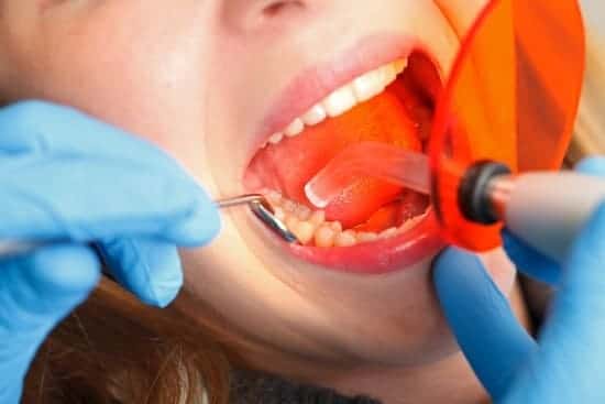 Dentist bonding a patients teeth
