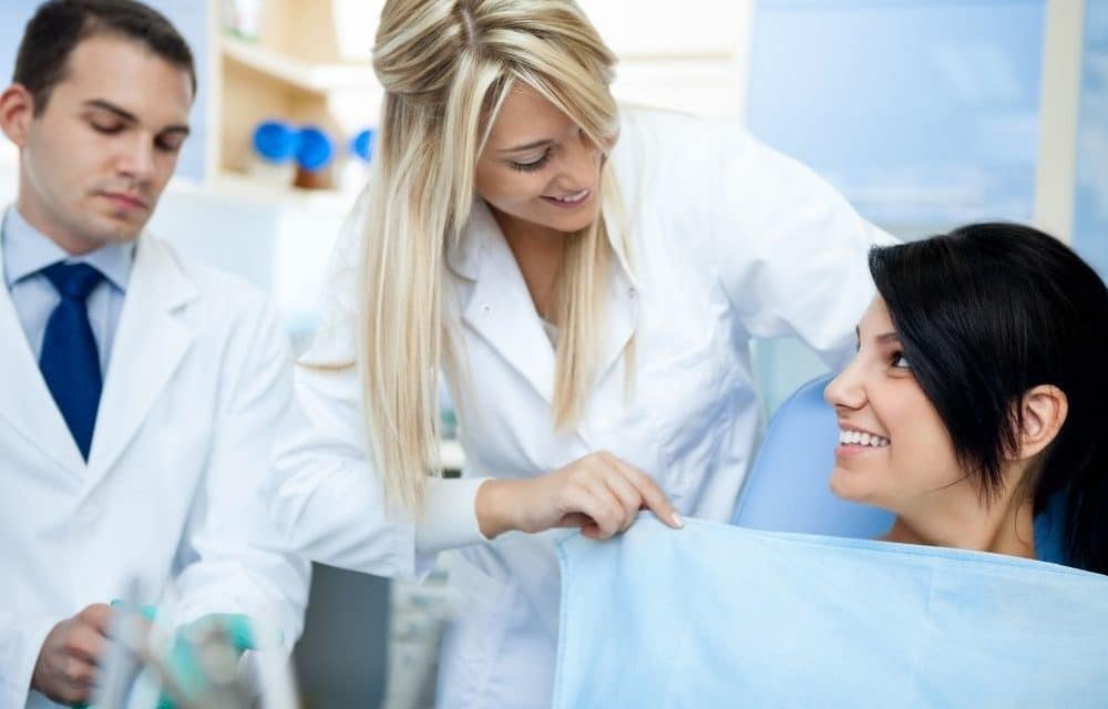 A dentist getting a patient ready for a procedure