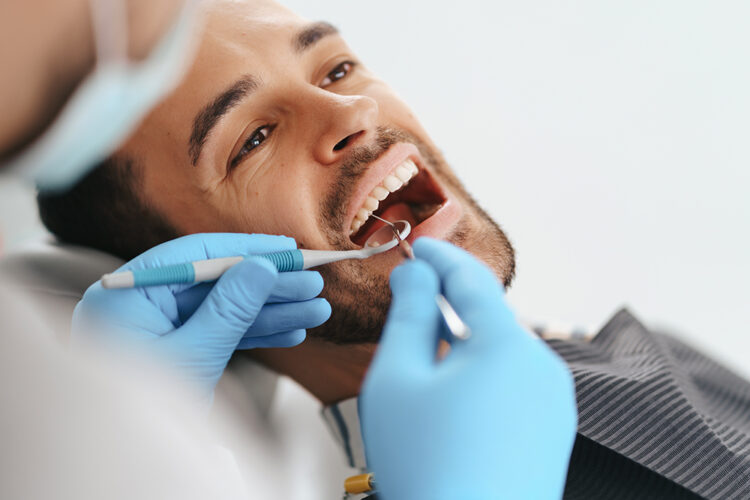 Dental patient being treated by Dr Fadi Raffoul the Best Oral Surgeon in Brandon
