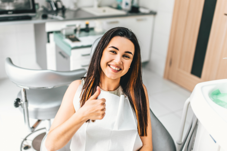 woman smiling after getting dental veneers